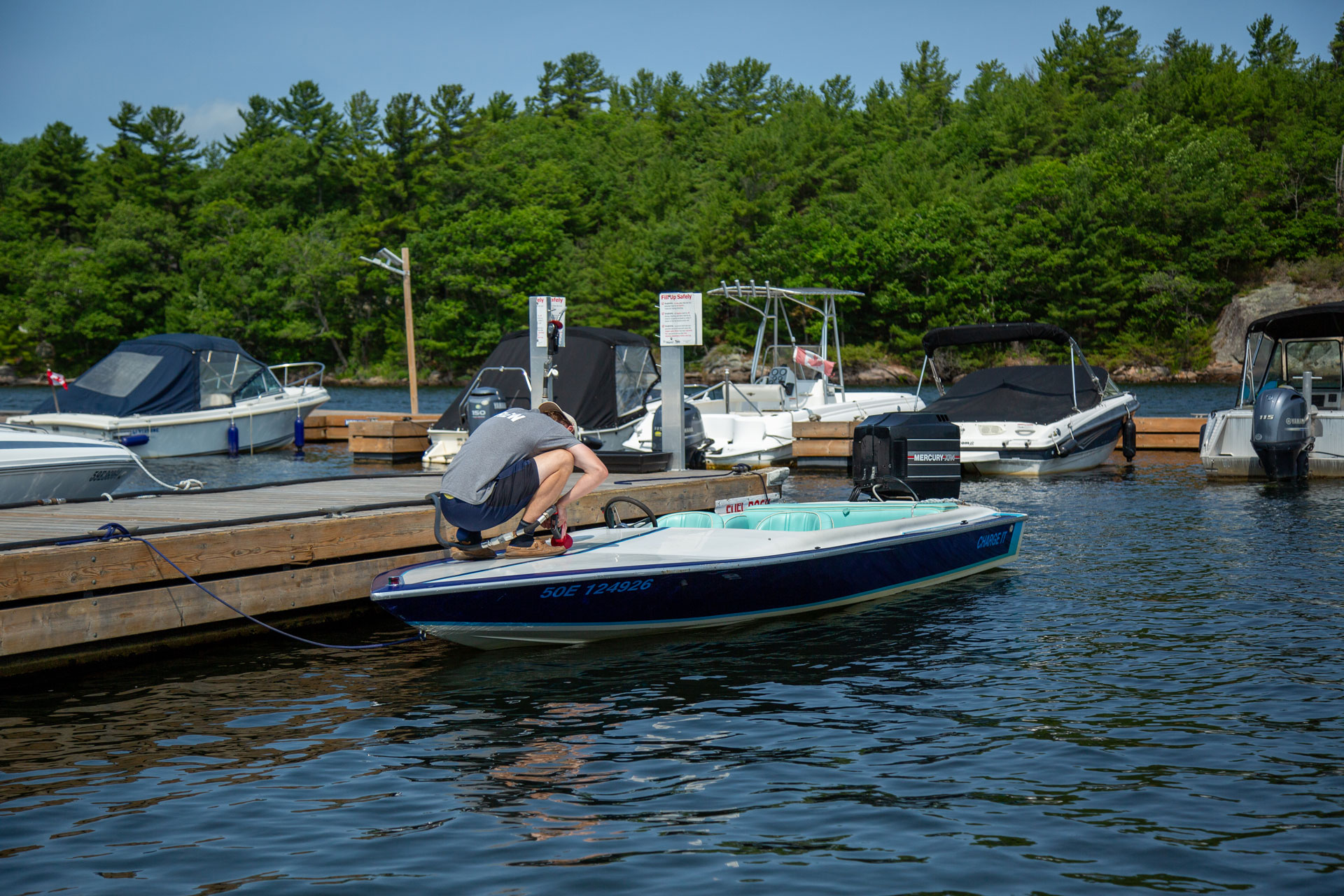 Dock Staff Fueling a Boat